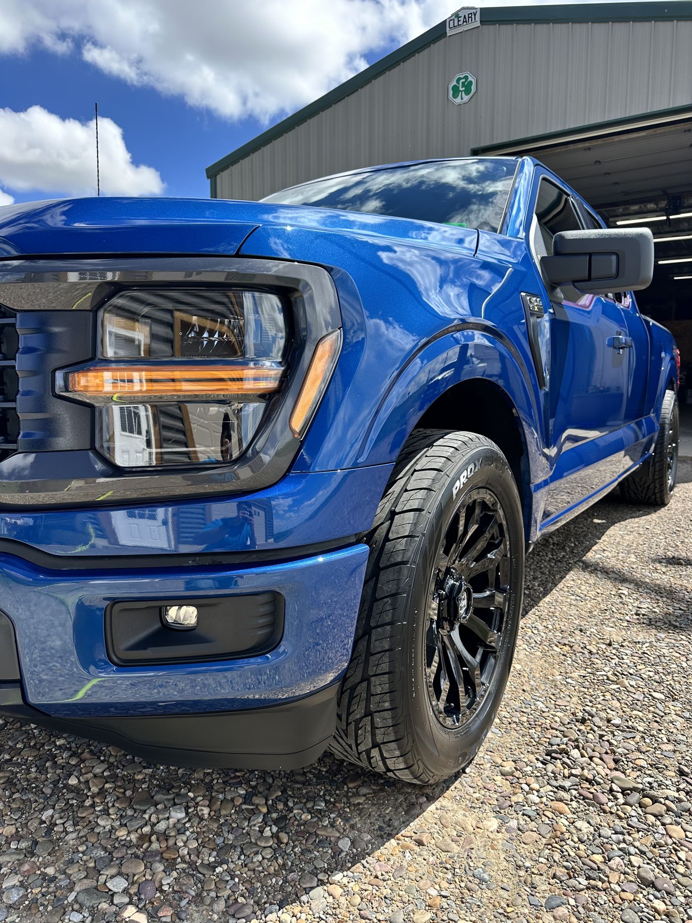 Freshly detailed blue Ford F-150 at the Chinook shop